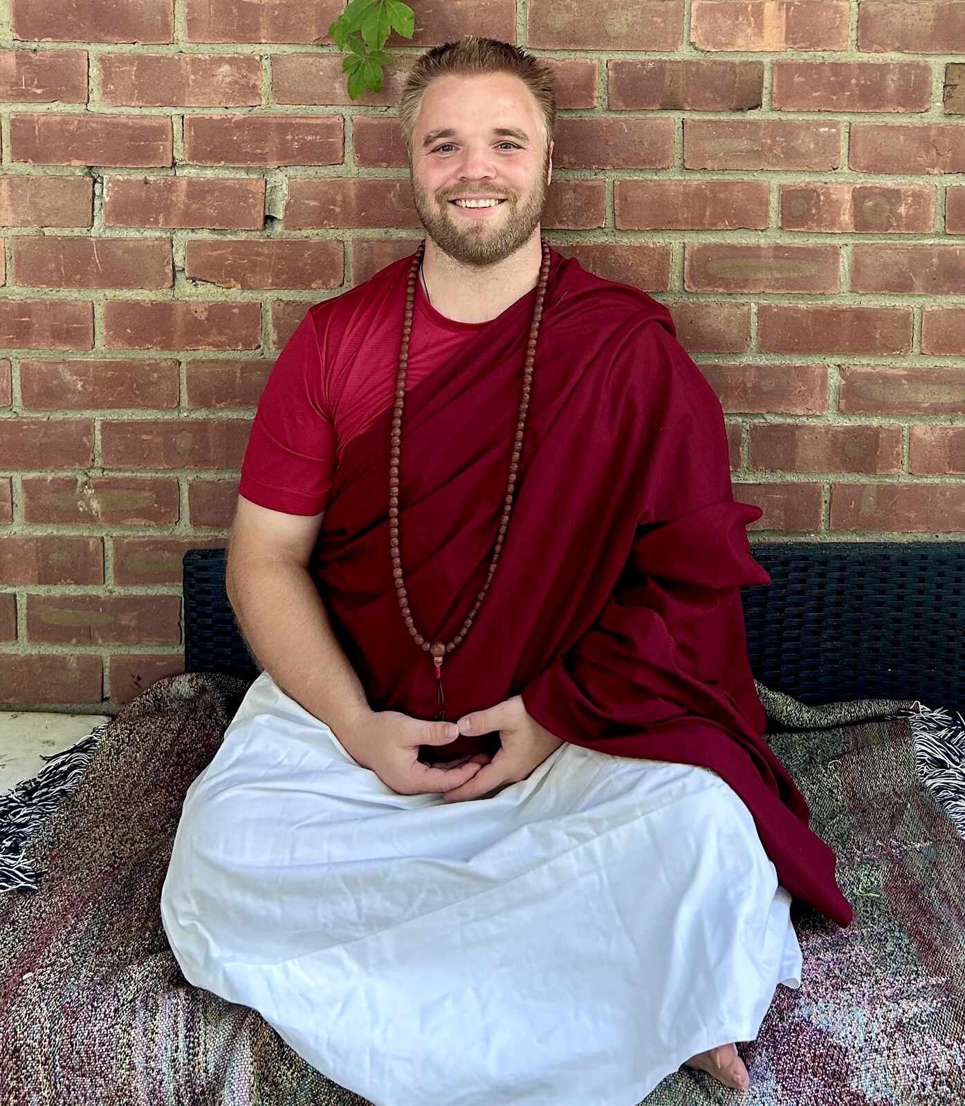 Davis Trachte seated in meditation