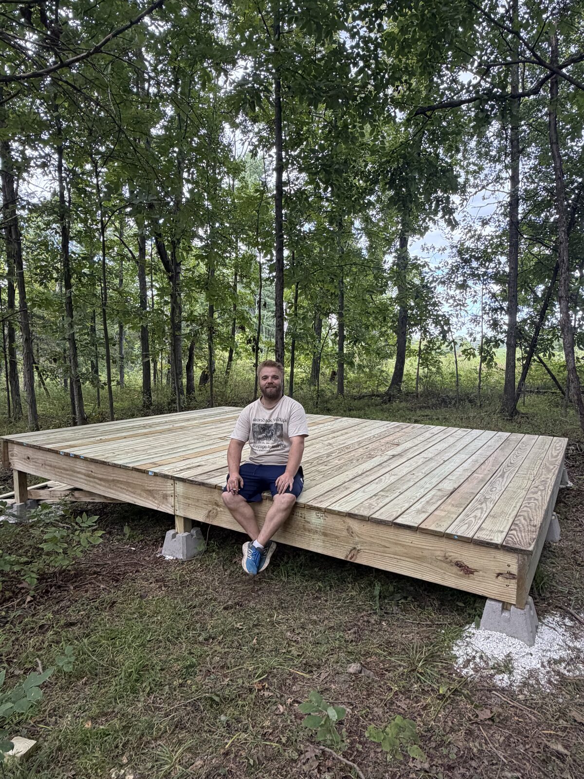 A newly built wooden platform on forested land